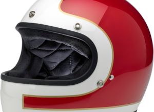 Injection-molded ABS outer shell with hand-painted finish Expanded polystyrene inner shell Hand-sewn, removable, brushed Lycra® liner with contrasting diamond-stitched quilted open-cell foam padding Internal BioFoam chin pad with hand-sewn contrast stitching Rugged, plated steel D-ring neck strap with adjustment strap end retainer Rubber or chrome accented edging on shell