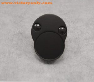 Billet Aluminum Victory Motorcycle Octane Swing Arm Pivot Bolt Cover shown installed in Black
