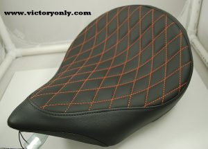 solo seat black orange thread diamond pattern