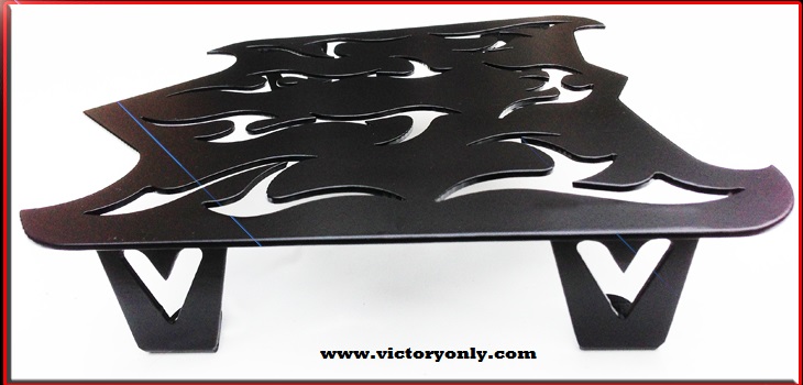 NEW VICTORY SKULL TRUNK VICTORY LUGGAGE RACK MADE OUT OF 12 GUAGE STEEL MOUNTS TO THE TOP OF YOUR TRUNK LID COMES WITH CHROME GARDNER WESCOTT MOUNTING HARDWARE MADE HERE IN THE USA POWDERCOATED SATIN BLACK FOR A LONG LASTING FINISH LOOKS AMAZING WITH OUR CUSTOM VICTORY HANDLEBARS Check out our other luggage rack designs DIMENSIONS APPROX 12 L x 14 W Takes 3-4 days to Build and ship